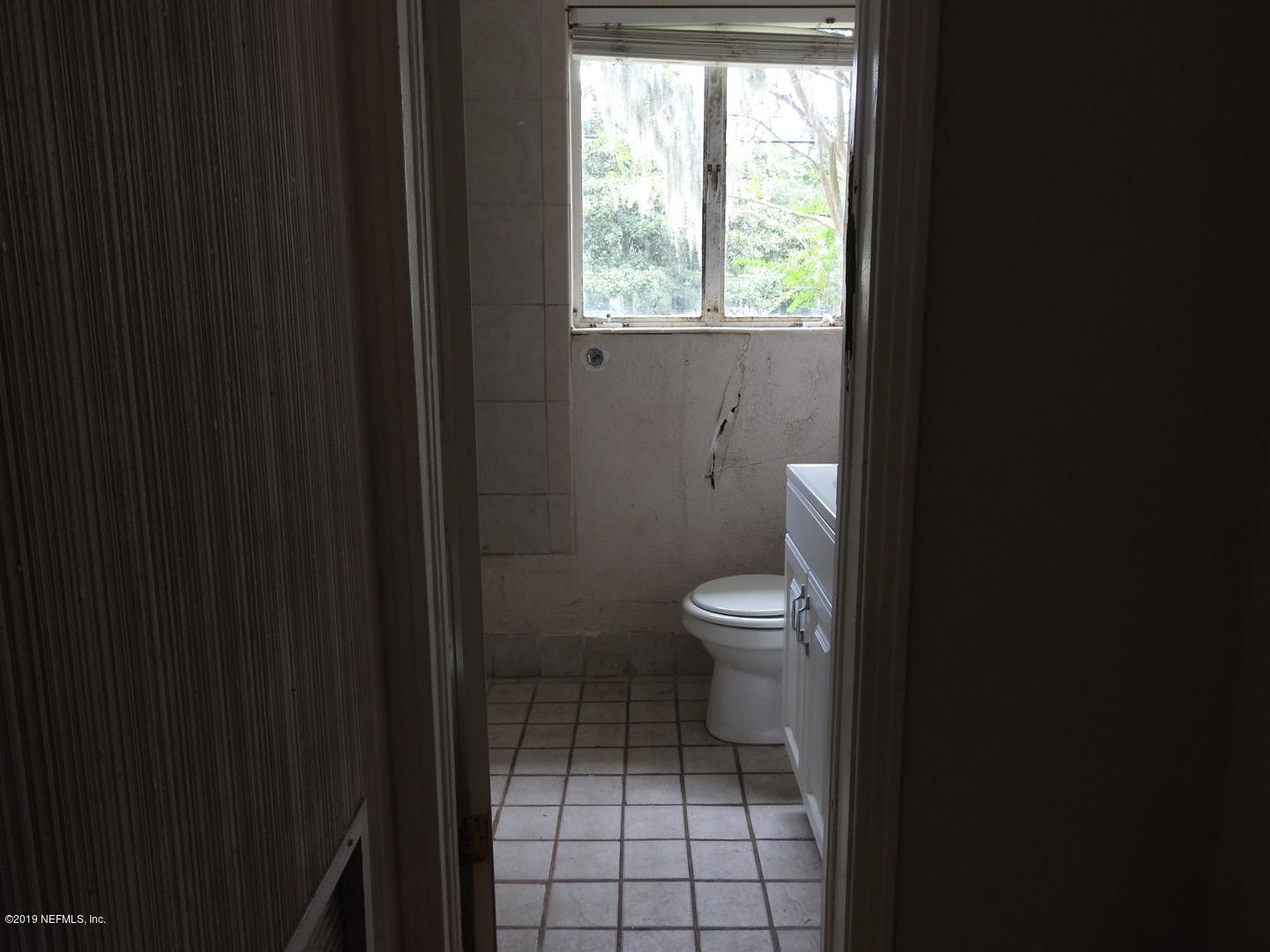 4238 Springwood Road Jacksonville, FL 32207 - Photo 12 of 19 a bathroom with a toilet