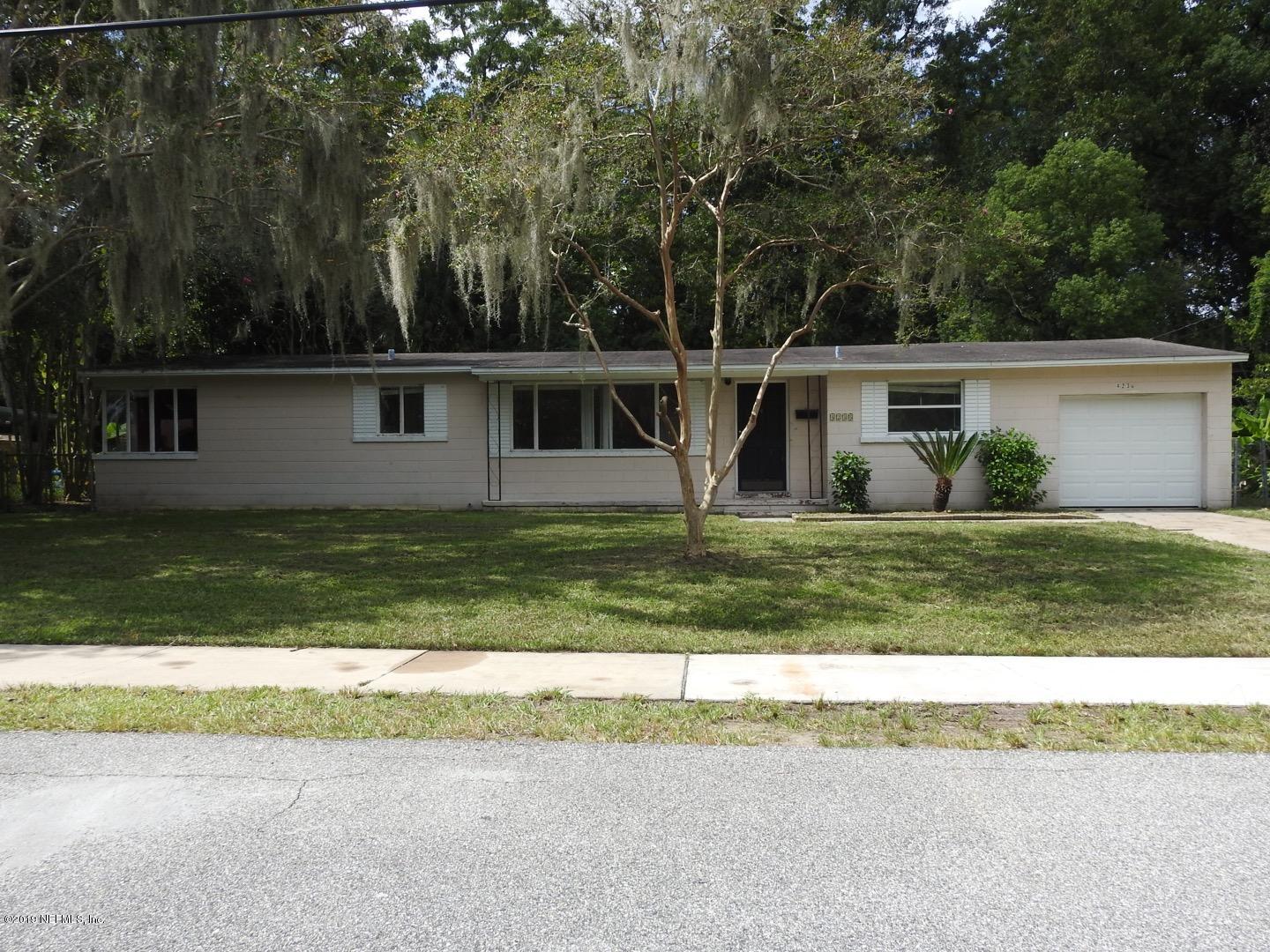 4238 Springwood Road Jacksonville, FL 32207 - Photo 2 of 19 front view of house with a yard