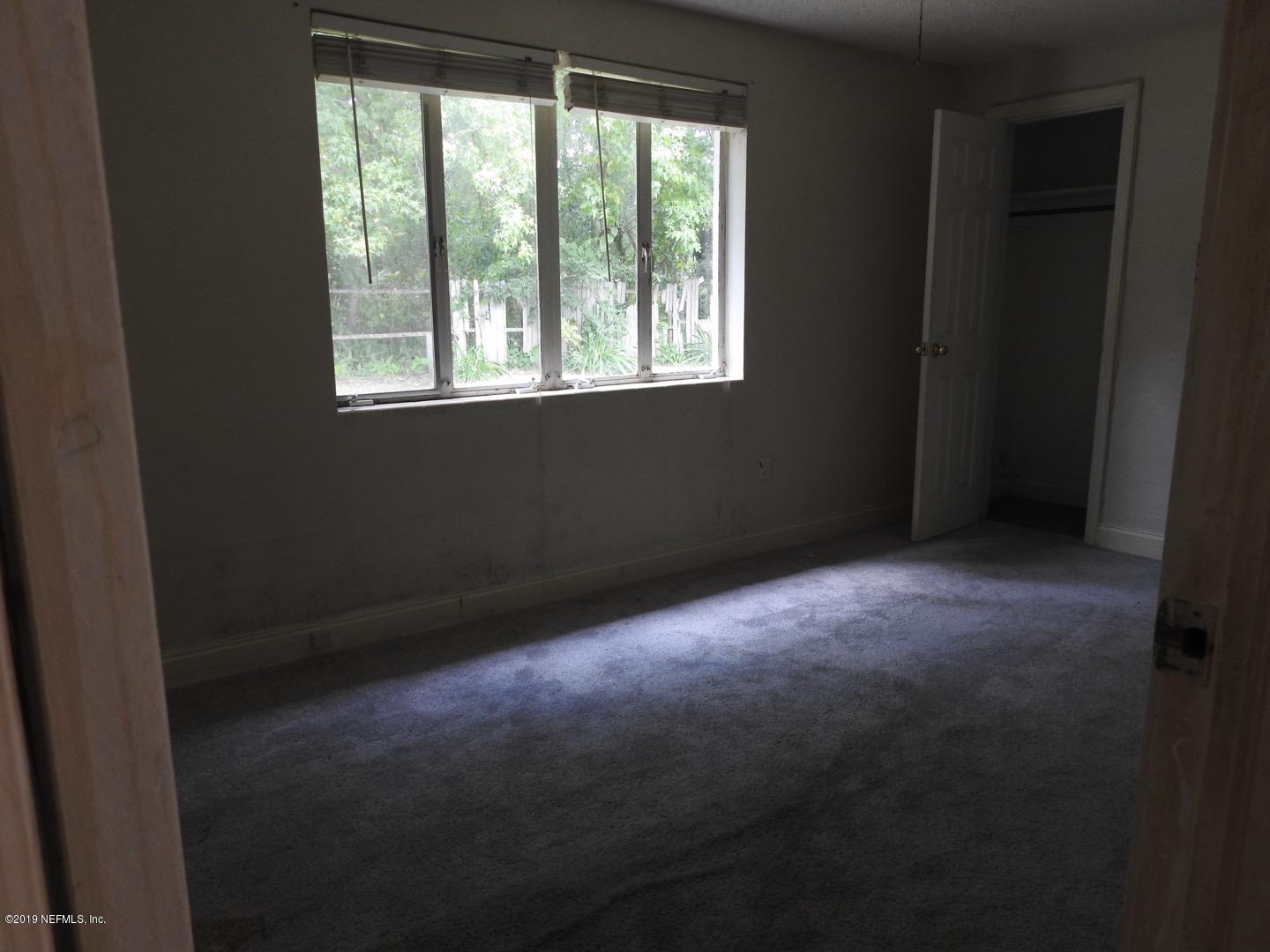 4238 Springwood Road Jacksonville, FL 32207 - Photo 9 of 19 a view of empty room with window