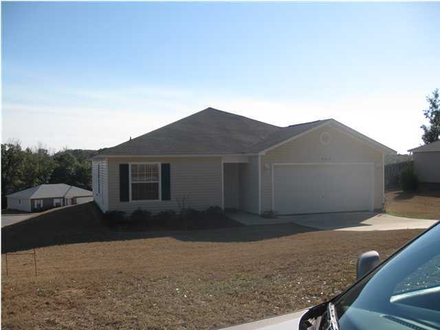 305 Seclusion Boulevard Crestview, FL 32536 - Photo 2 of 12 a backyard of a house with lots of green space
