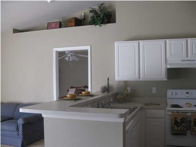 305 Seclusion Boulevard Crestview, FL 32536 - Photo 4 of 12 a kitchen with a sink and cabinets