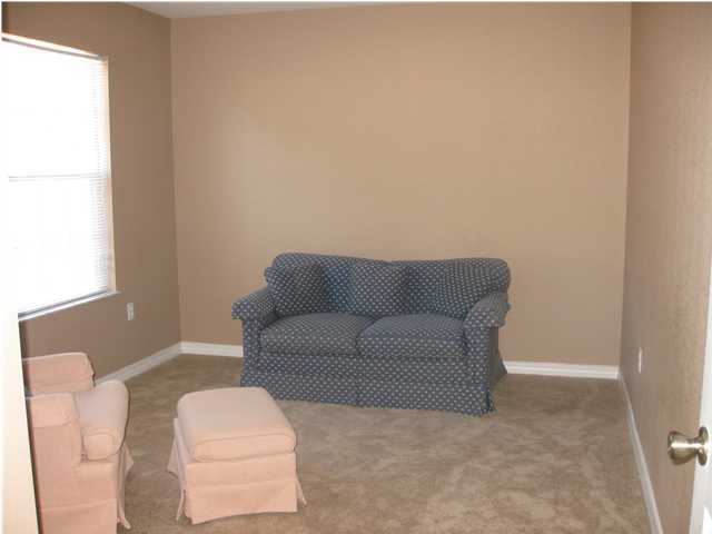 305 Seclusion Boulevard Crestview, FL 32536 - Photo 6 of 12 a living room with furniture and a window