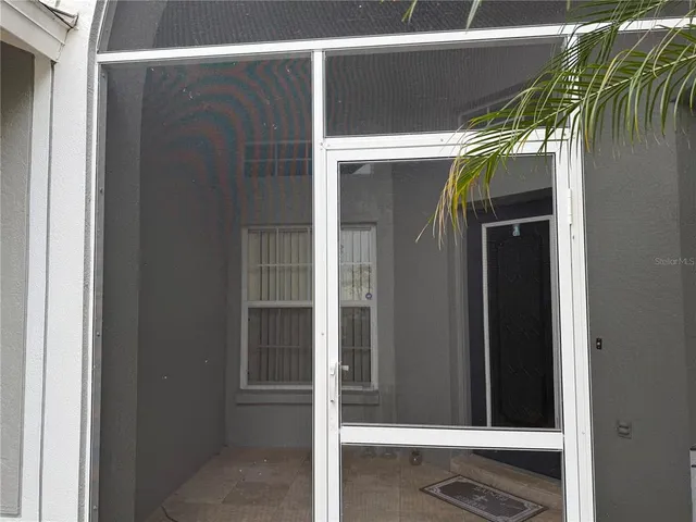 a view of a walk in front of house