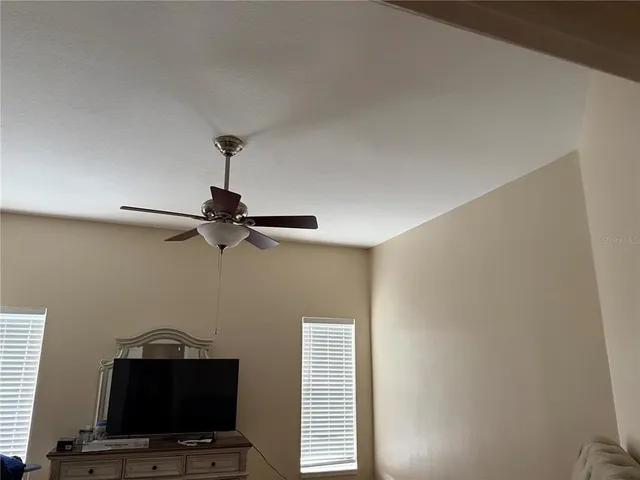 a view of room with a flat screen tv