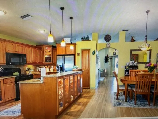 a view of a kitchen and dining room