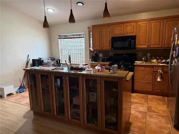 a kitchen with lots of counter top space and appliances