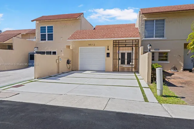 a front view of a house with a garage