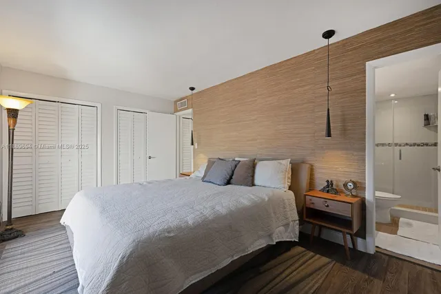 a bedroom with a bed and a closet