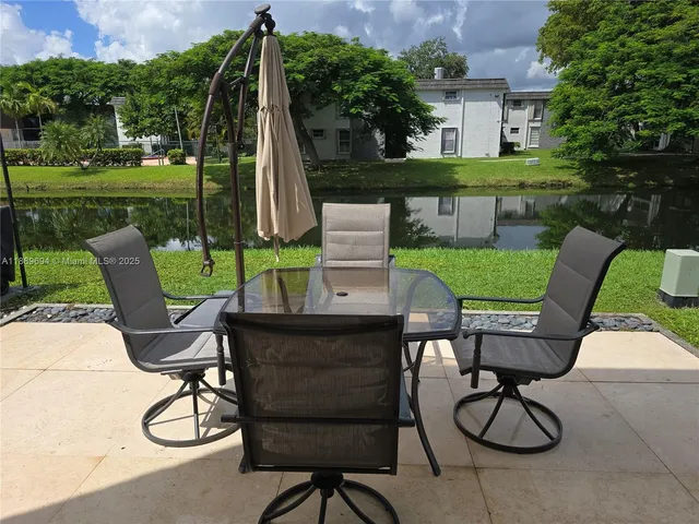 a view of a table and chairs in the patio