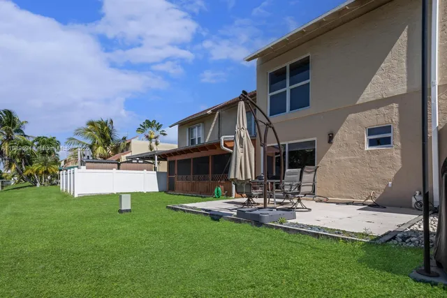 a view of a house with a yard porch and sitting area