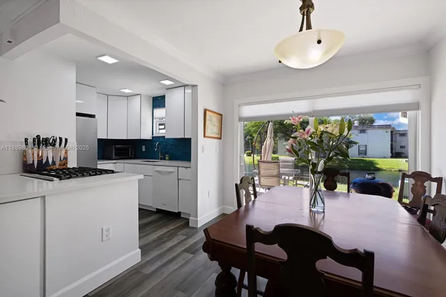 a view of a dining room with furniture window and outside view