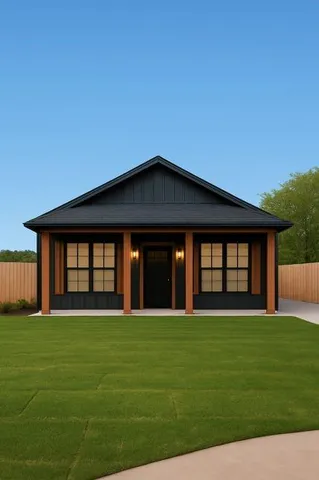 a large house with a big yard and large trees