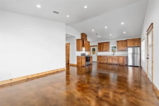 an open kitchen with a table and chairs in it