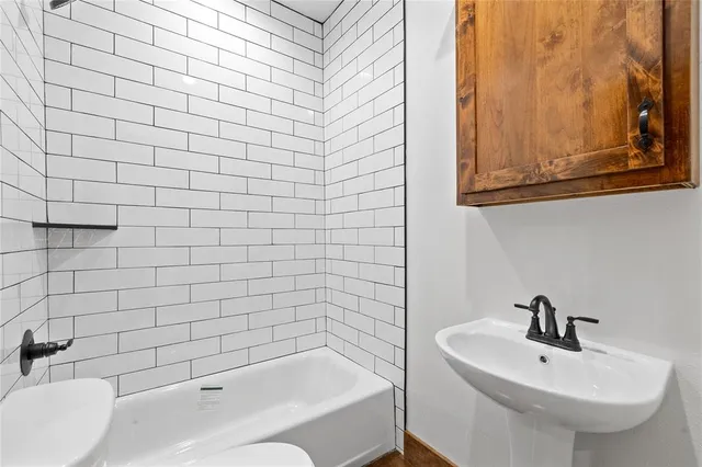 a bathroom with a sink and a bathtub