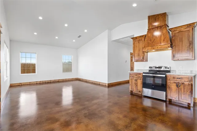 a view of a kitchen with a sink and a stove top oven