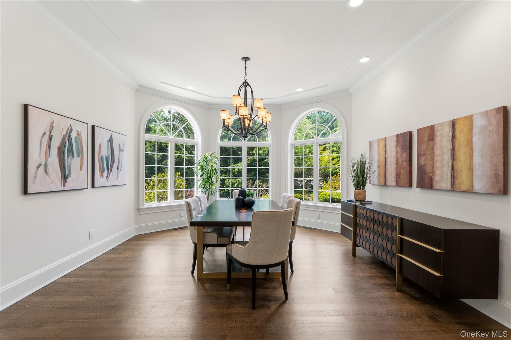 1960 Midlane Road South Syosset, NY 11791 - Photo 9 of 46 a dining room with furniture a chandelier and wooden floor