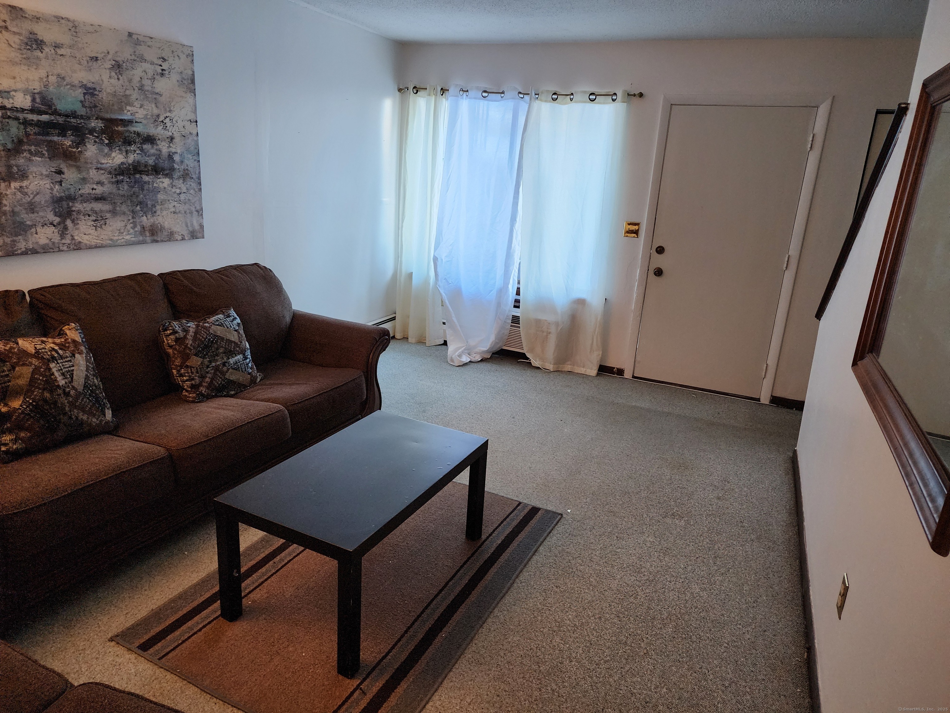 189 Kaynor Drive, Unit C Waterbury, CT 06708 - Photo 1 of 6 a living room with furniture and a window