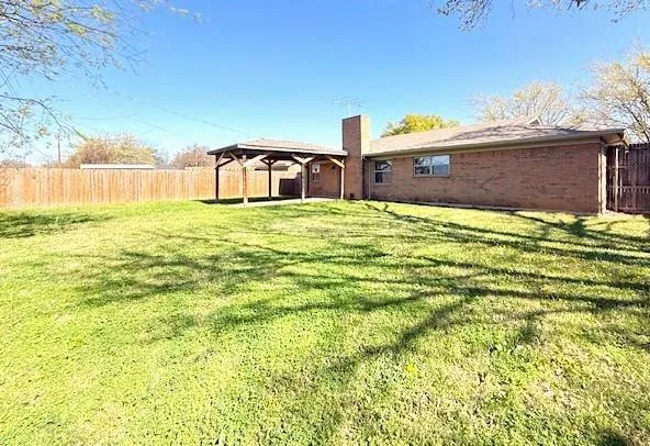 a view of a houses with an outdoor space and seating area
