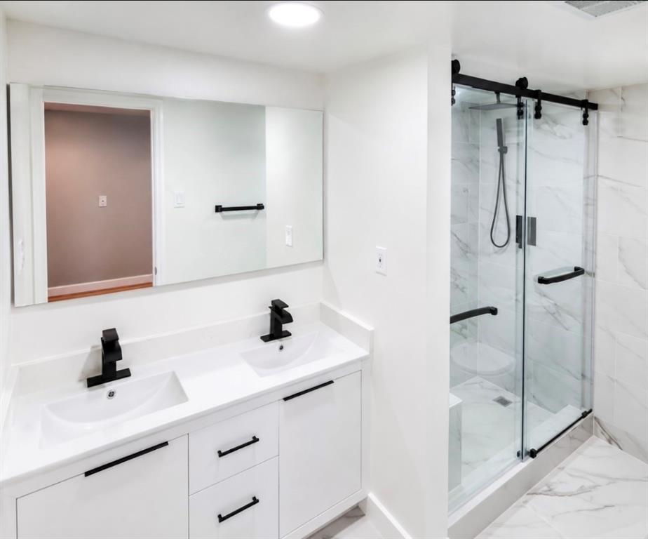 15889 Preston Road, Unit 1004 Dallas, TX 75248 - Photo 12 of 17 a bathroom with a sink and a mirror