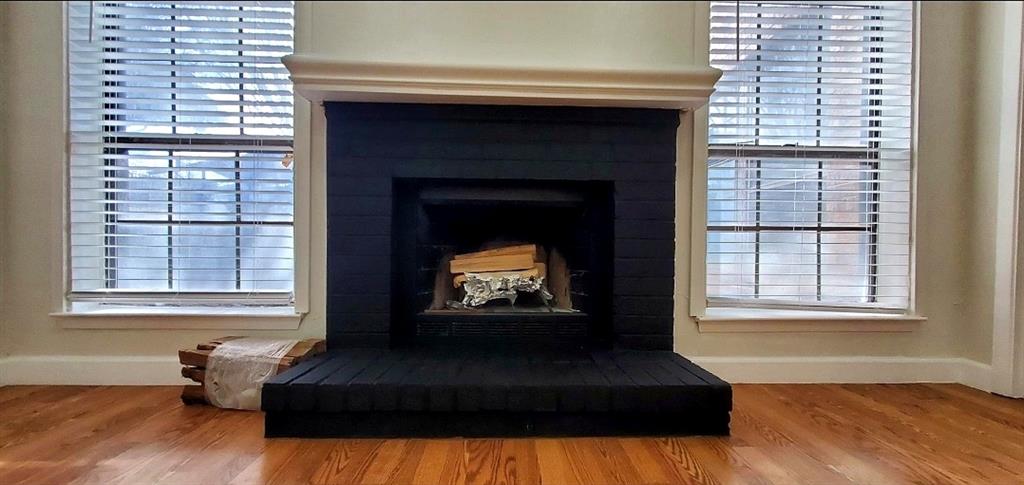 15889 Preston Road, Unit 1004 Dallas, TX 75248 - Photo 5 of 17 a living room with furniture and a fireplace