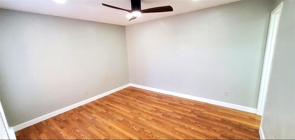15889 Preston Road, Unit 1004 Dallas, TX 75248 - Photo 8 of 17 a view of small space with wooden floor