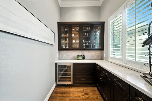 a kitchen with a sink and wooden cabinets