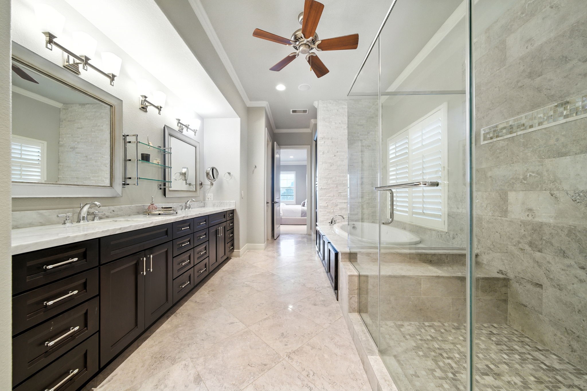 803 Bomar Street, Unit A Houston, TX 77006 - Photo 24 of 39 a spacious bathroom with a double vanity sink a toilet a mirror and shower
