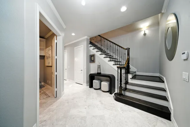 a view of entryway and hall with wooden floor
