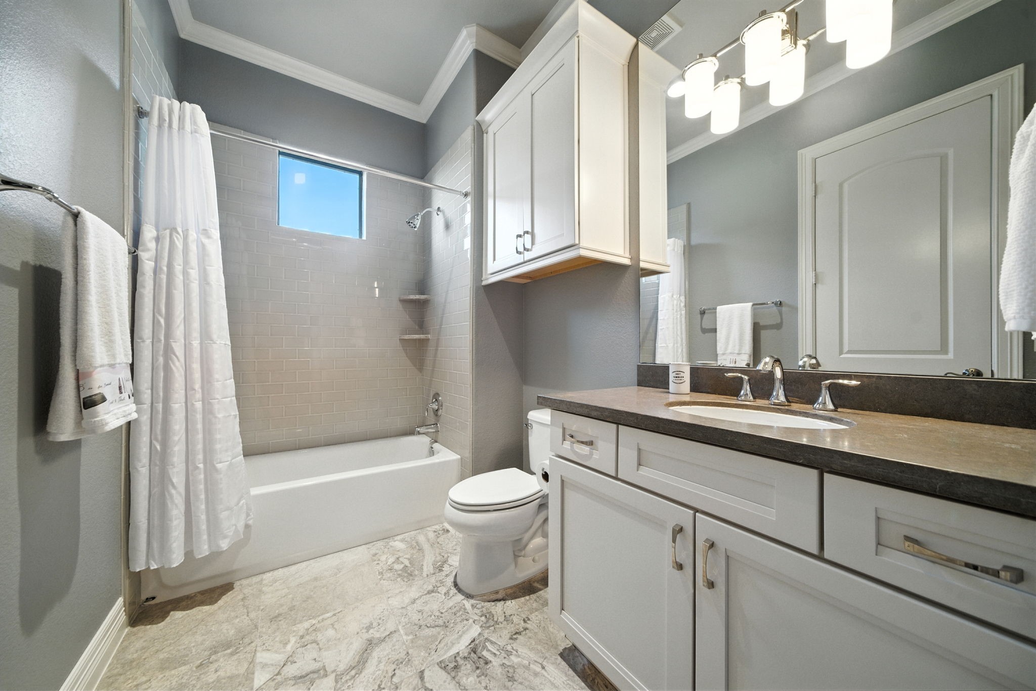 803 Bomar Street, Unit A Houston, TX 77006 - Photo 29 of 39 a bathroom with a sink a toilet and shower