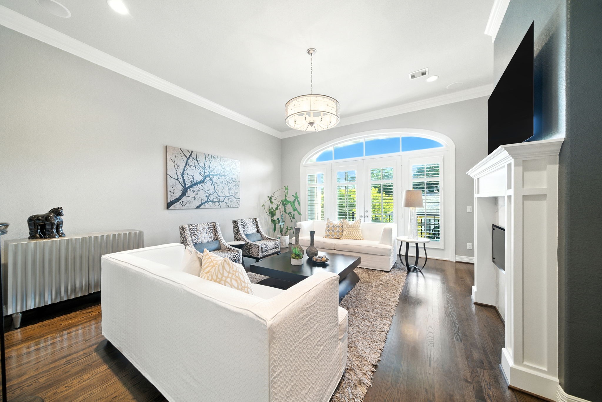 803 Bomar Street, Unit A Houston, TX 77006 - Photo 7 of 39 a living room with furniture a flat screen tv and a table