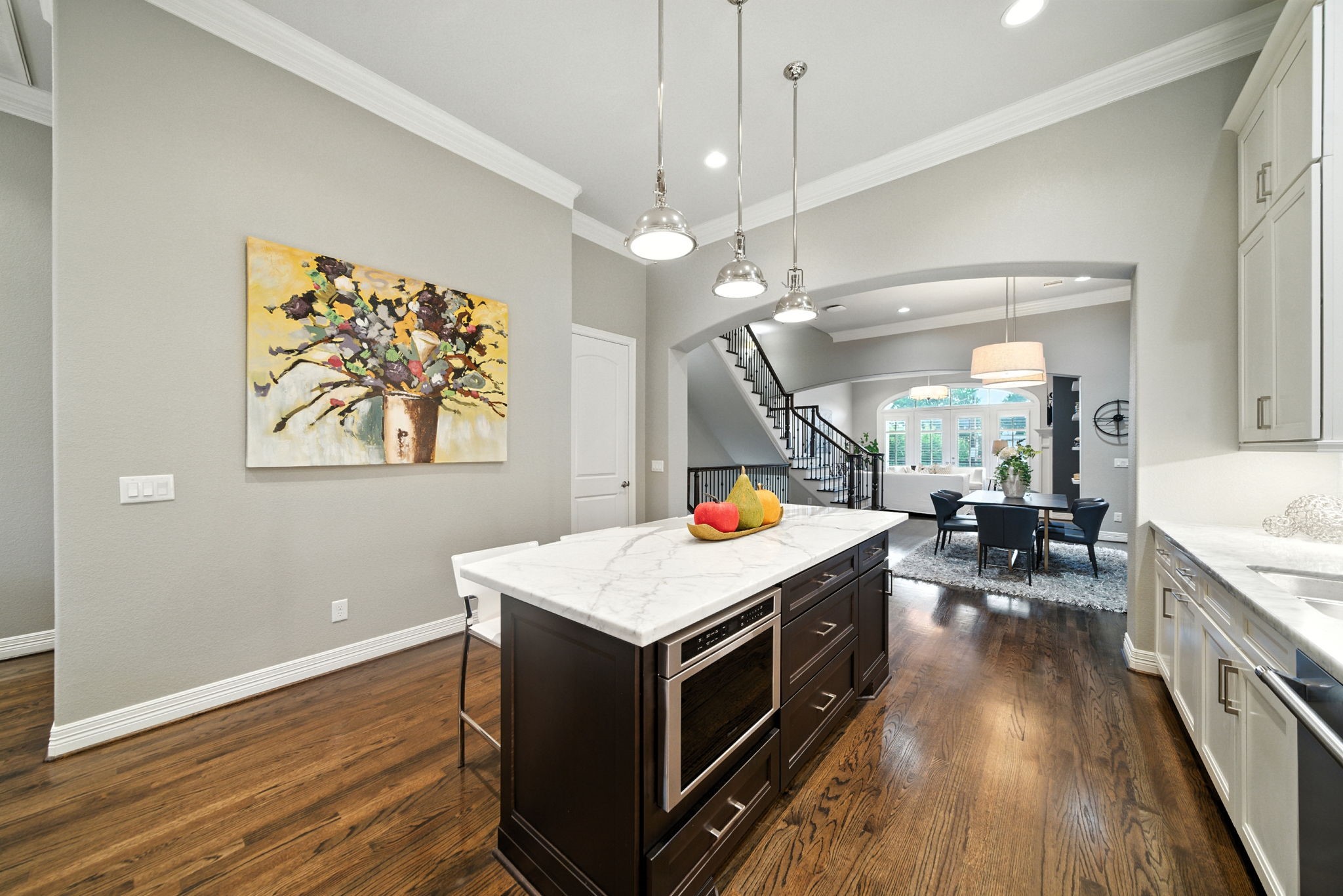 803 Bomar Street, Unit A Houston, TX 77006 - Photo 9 of 39 a kitchen that has a lot of cabinets a sink and wooden floor