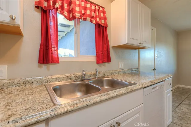 a close view of a sink and a microwave