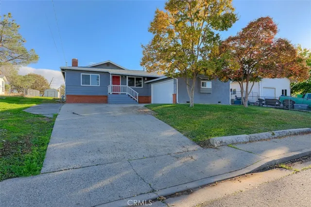 a front view of a house with yard