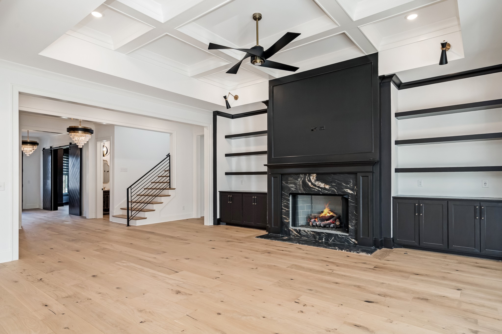 214 Old Peytonsville Road Franklin, TN 37064 - Photo 12 of 42 a view of an empty room with a fireplace and a ceiling fan