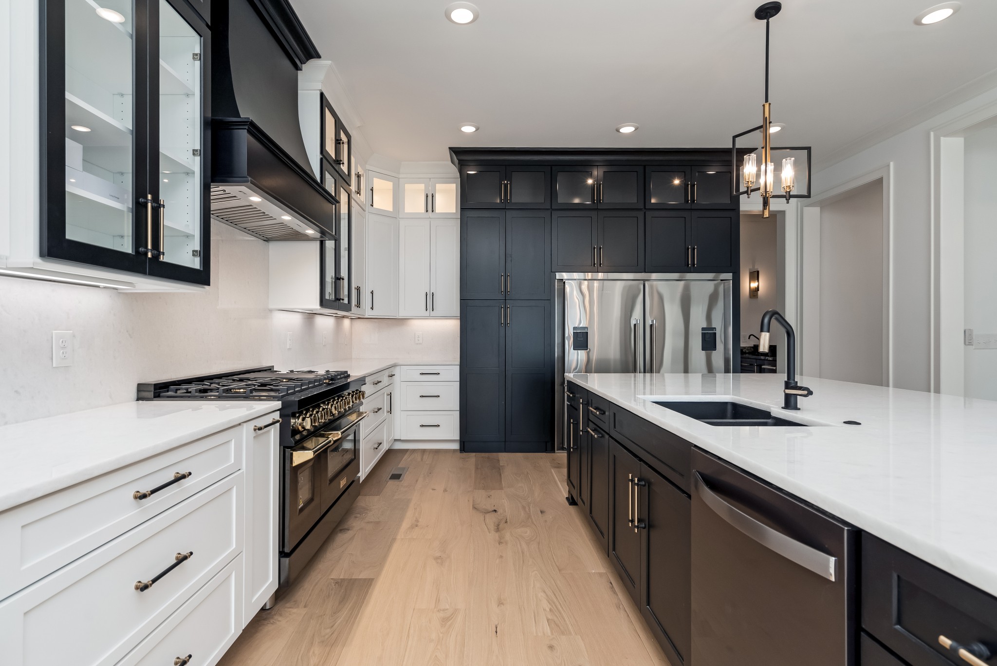 214 Old Peytonsville Road Franklin, TN 37064 - Photo 16 of 42 a kitchen with stainless steel appliances granite countertop a sink a stove and a refrigerator