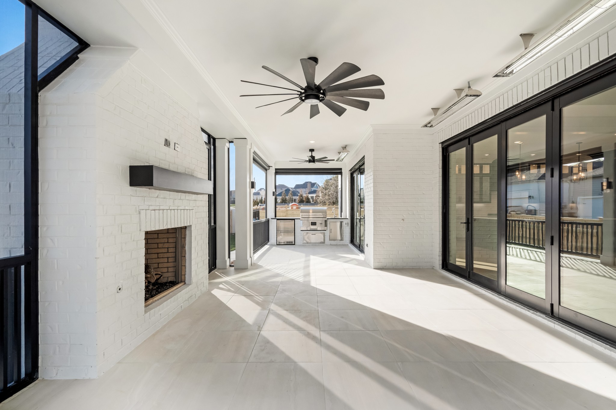 214 Old Peytonsville Road Franklin, TN 37064 - Photo 31 of 42 a bedroom with furniture fireplace and a ceiling fan