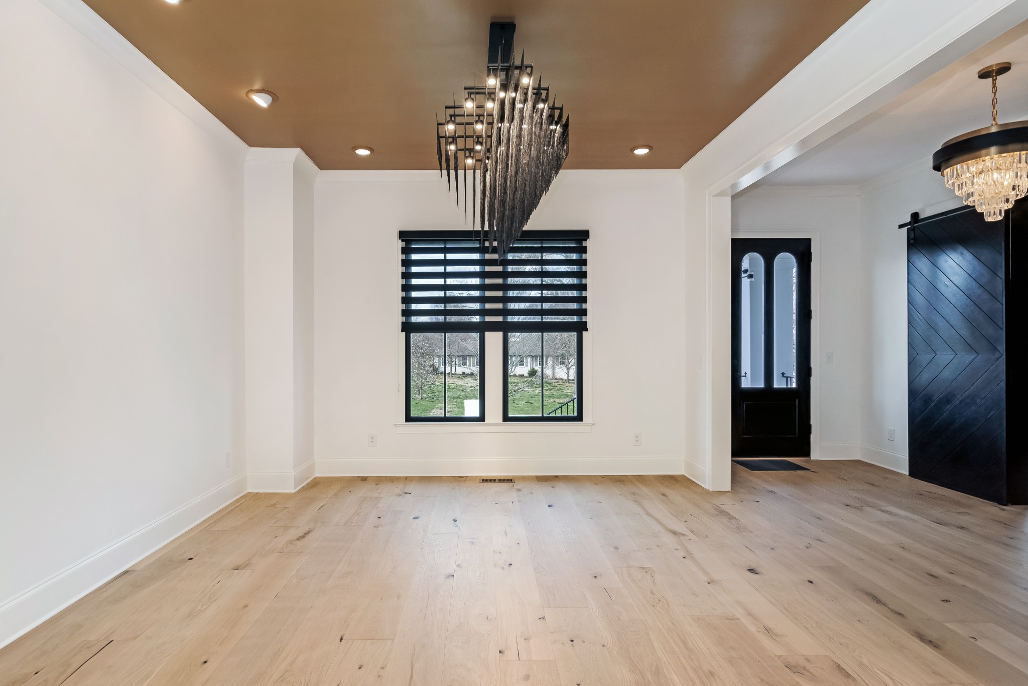 214 Old Peytonsville Road Franklin, TN 37064 - Photo 9 of 42 an empty room with wooden floor and windows