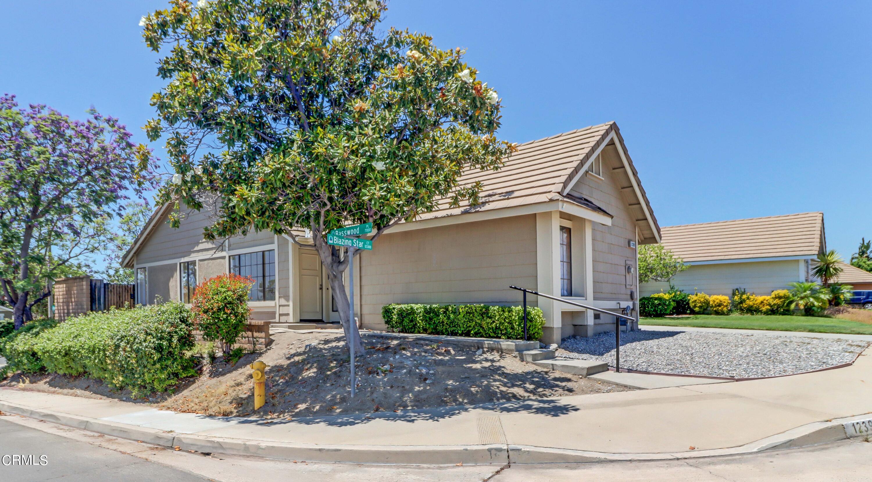 12399 Blazing Star Court Rancho Cucamonga, CA 91739 - Photo 1 of 24 a front view of a house with garden