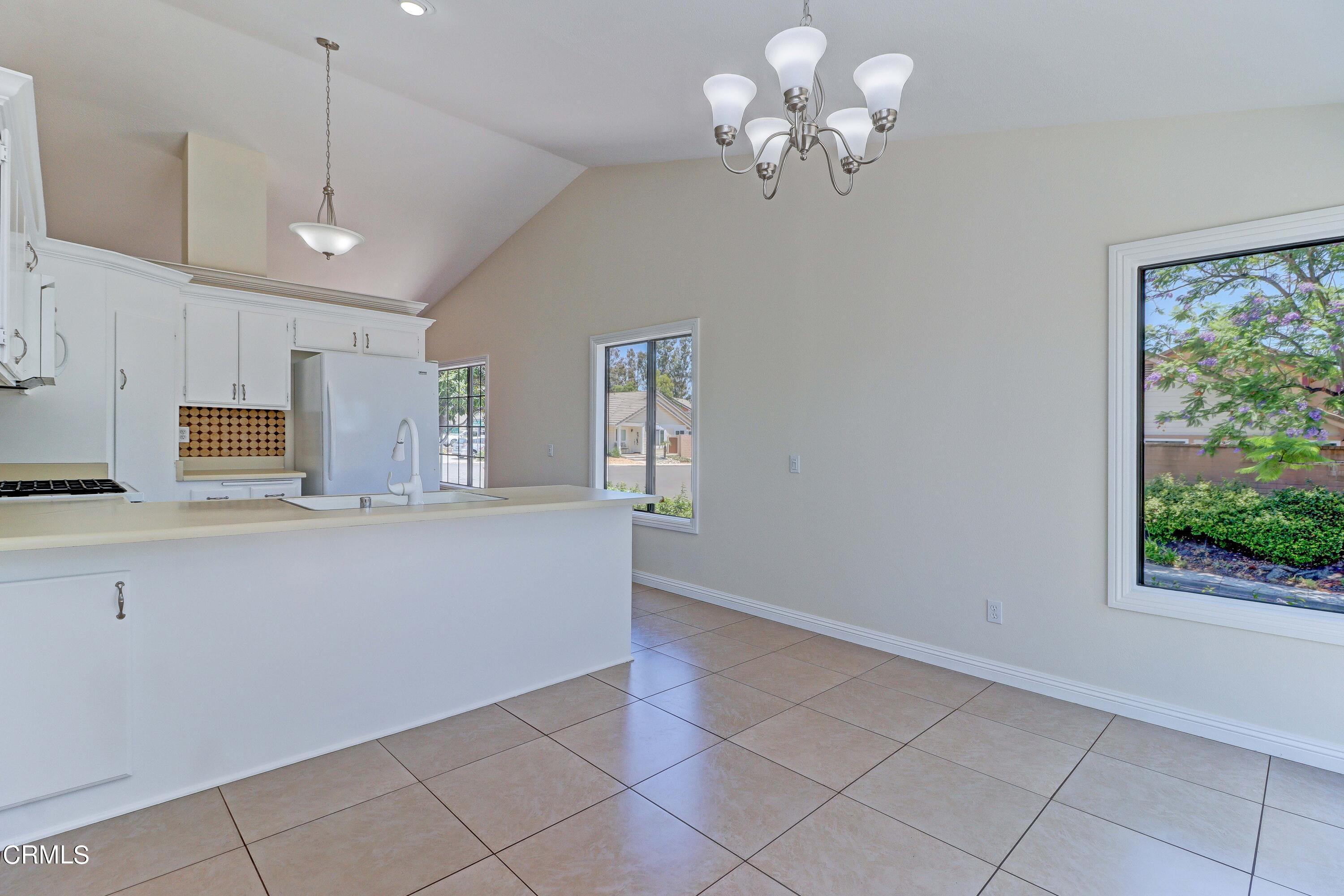 12399 Blazing Star Court Rancho Cucamonga, CA 91739 - Photo 11 of 24 a view of kitchen with center island and stainless steel appliances