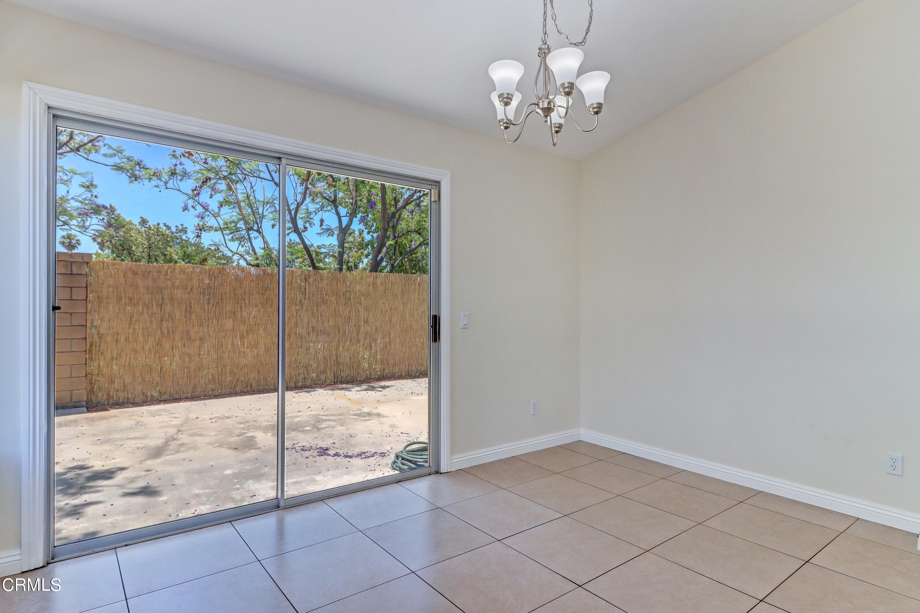 12399 Blazing Star Court Rancho Cucamonga, CA 91739 - Photo 12 of 24 a view of a big room with wooden floor and windows