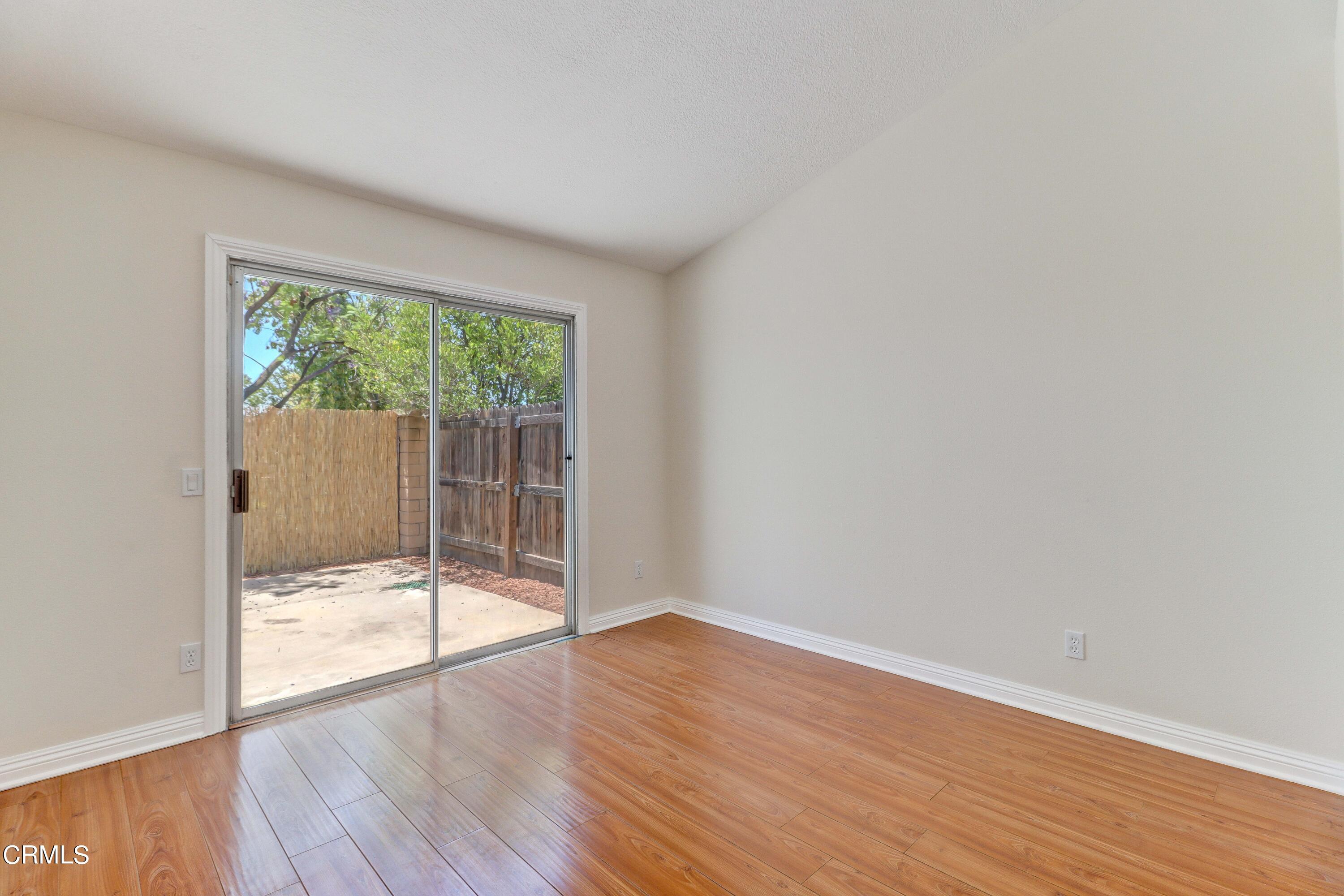 12399 Blazing Star Court Rancho Cucamonga, CA 91739 - Photo 13 of 24 an empty room with wooden floor and windows