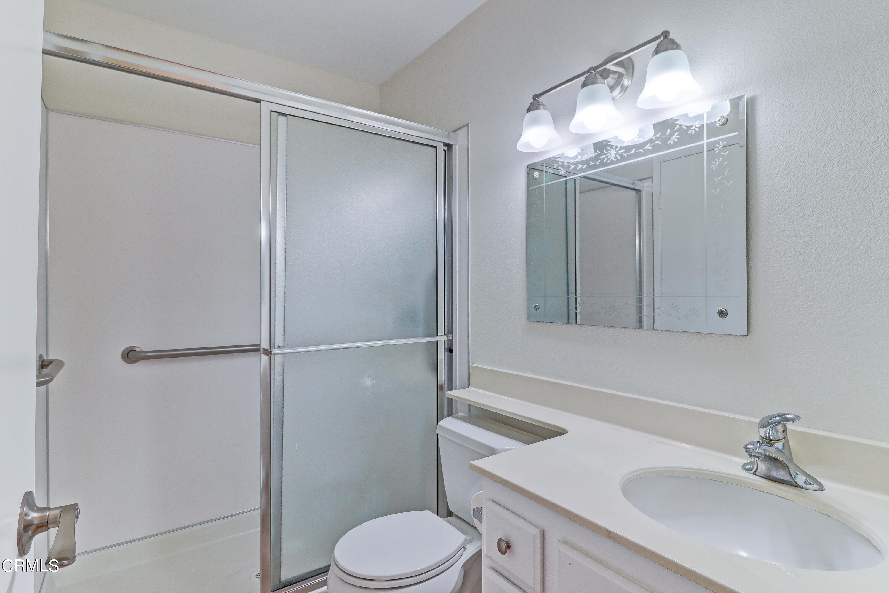 12399 Blazing Star Court Rancho Cucamonga, CA 91739 - Photo 16 of 24 a bathroom with a sink a toilet and shower