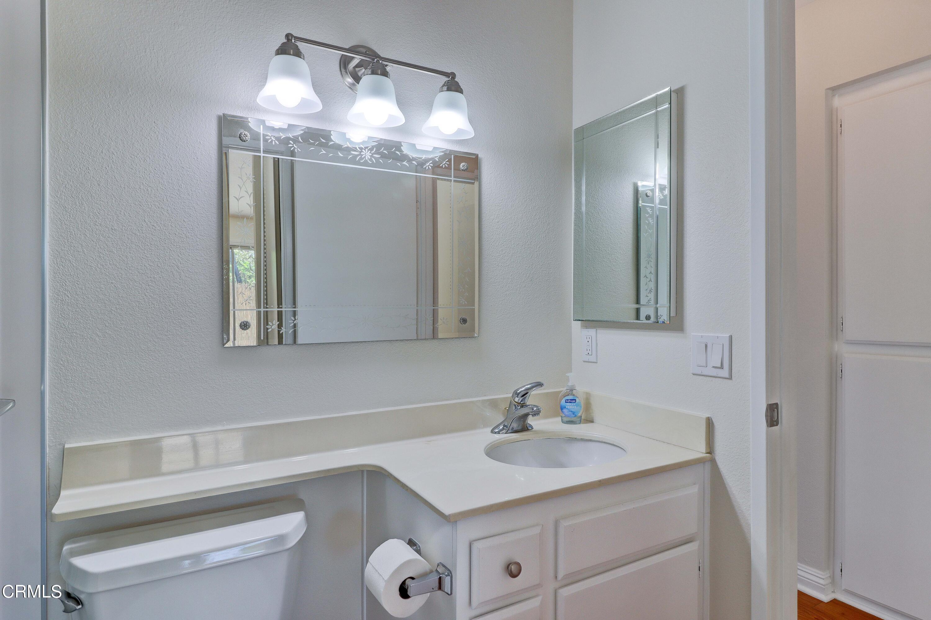 12399 Blazing Star Court Rancho Cucamonga, CA 91739 - Photo 17 of 24 a bathroom with a sink and a mirror
