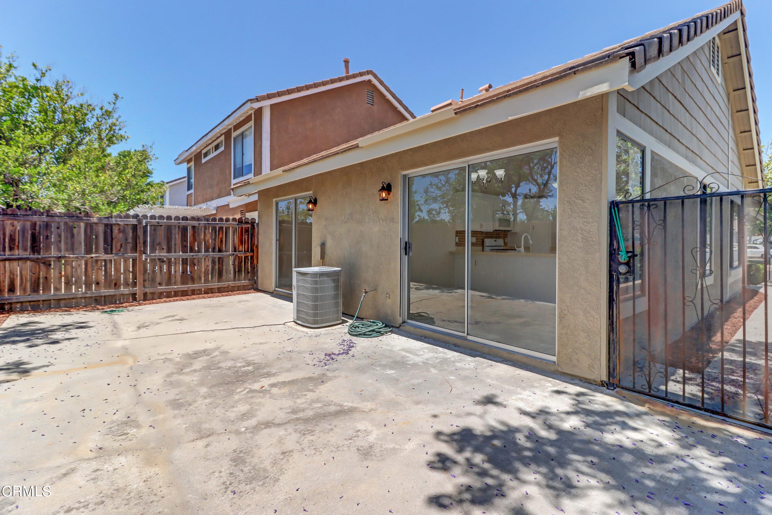 12399 Blazing Star Court Rancho Cucamonga, CA 91739 - Photo 20 of 24 a view of a small house with wooden fence