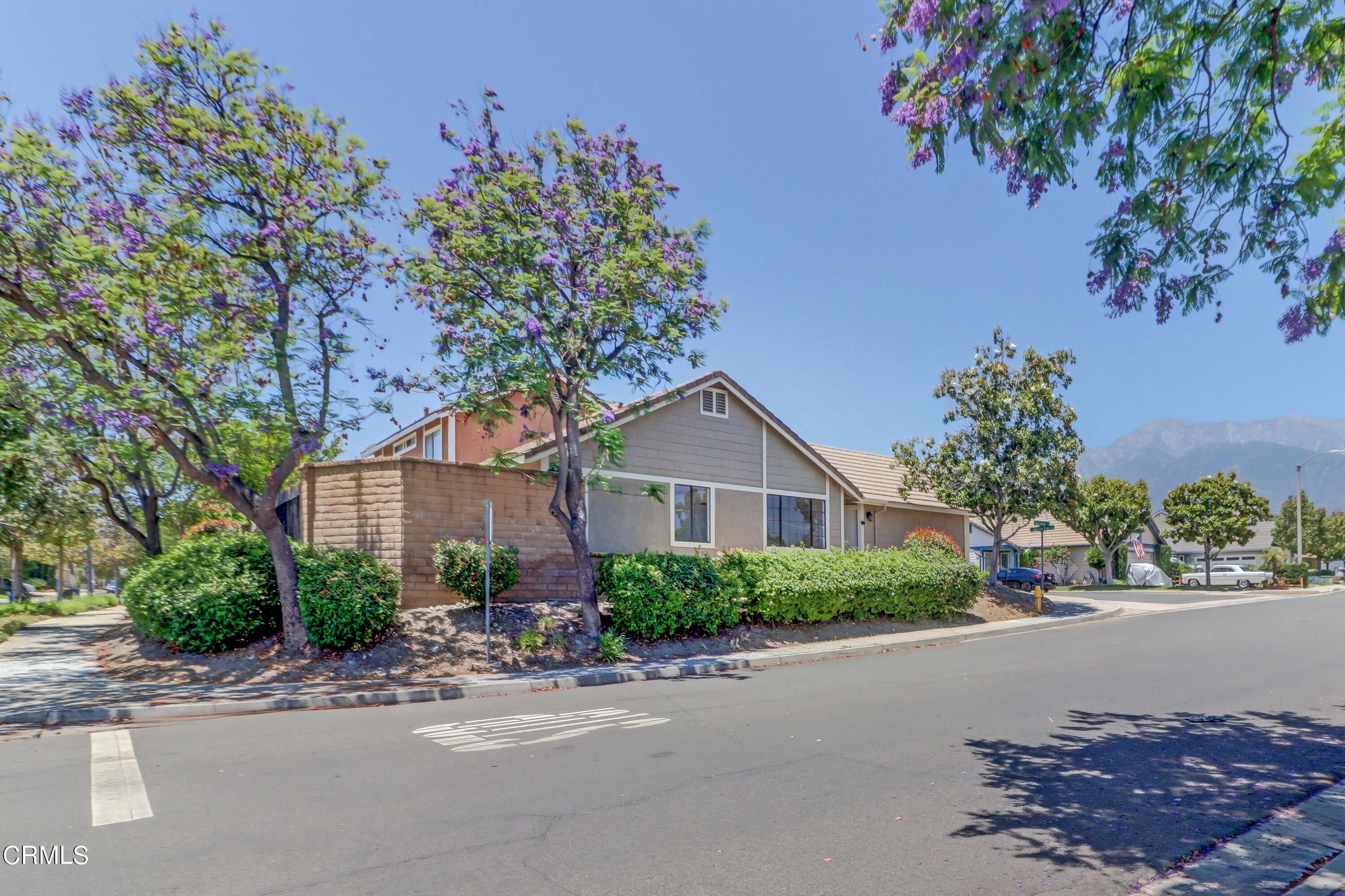 12399 Blazing Star Court Rancho Cucamonga, CA 91739 - Photo 24 of 24 a front view of a house with a yard and garage