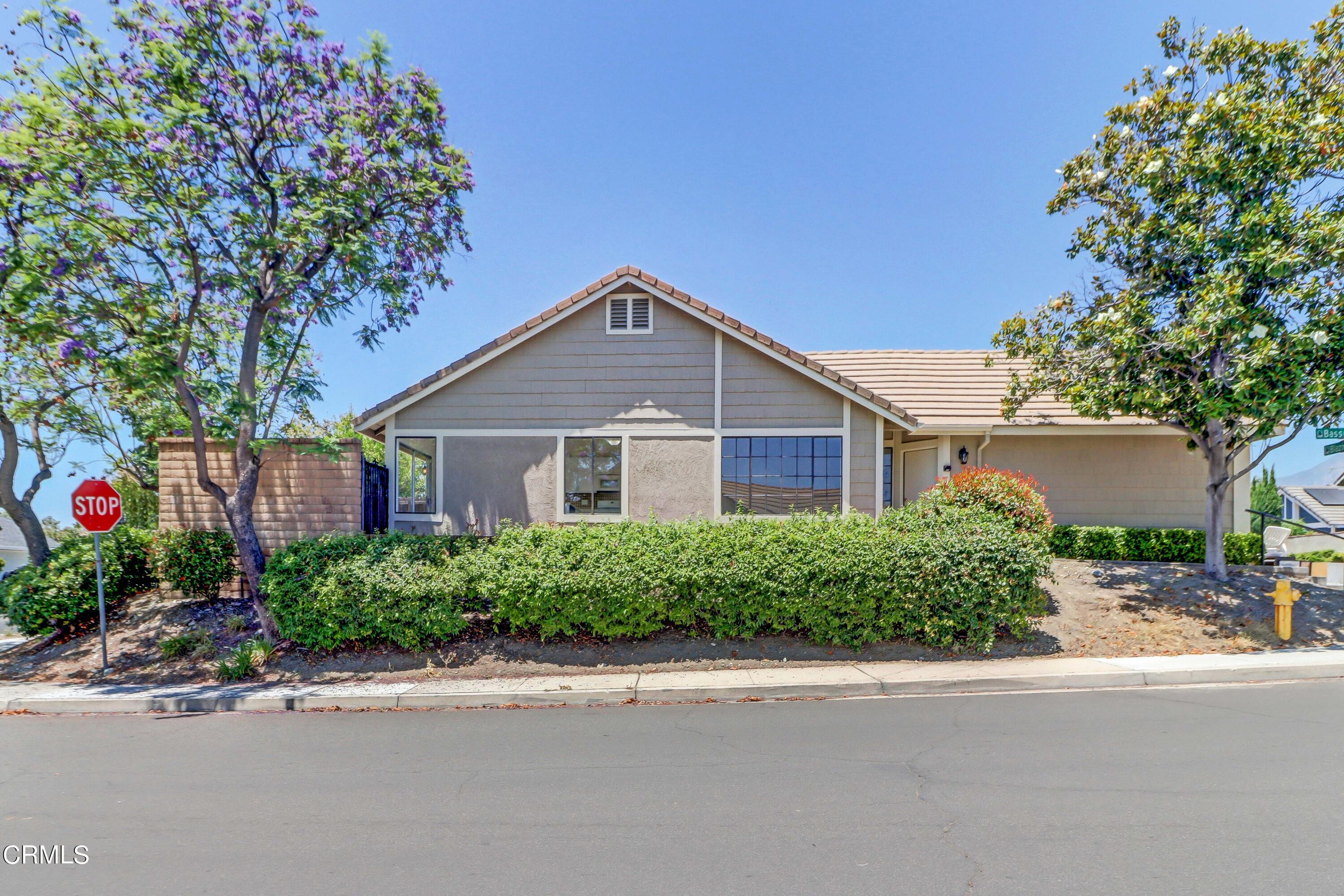 12399 Blazing Star Court Rancho Cucamonga, CA 91739 - Photo 3 of 24 a front view of a house with a yard and a garage
