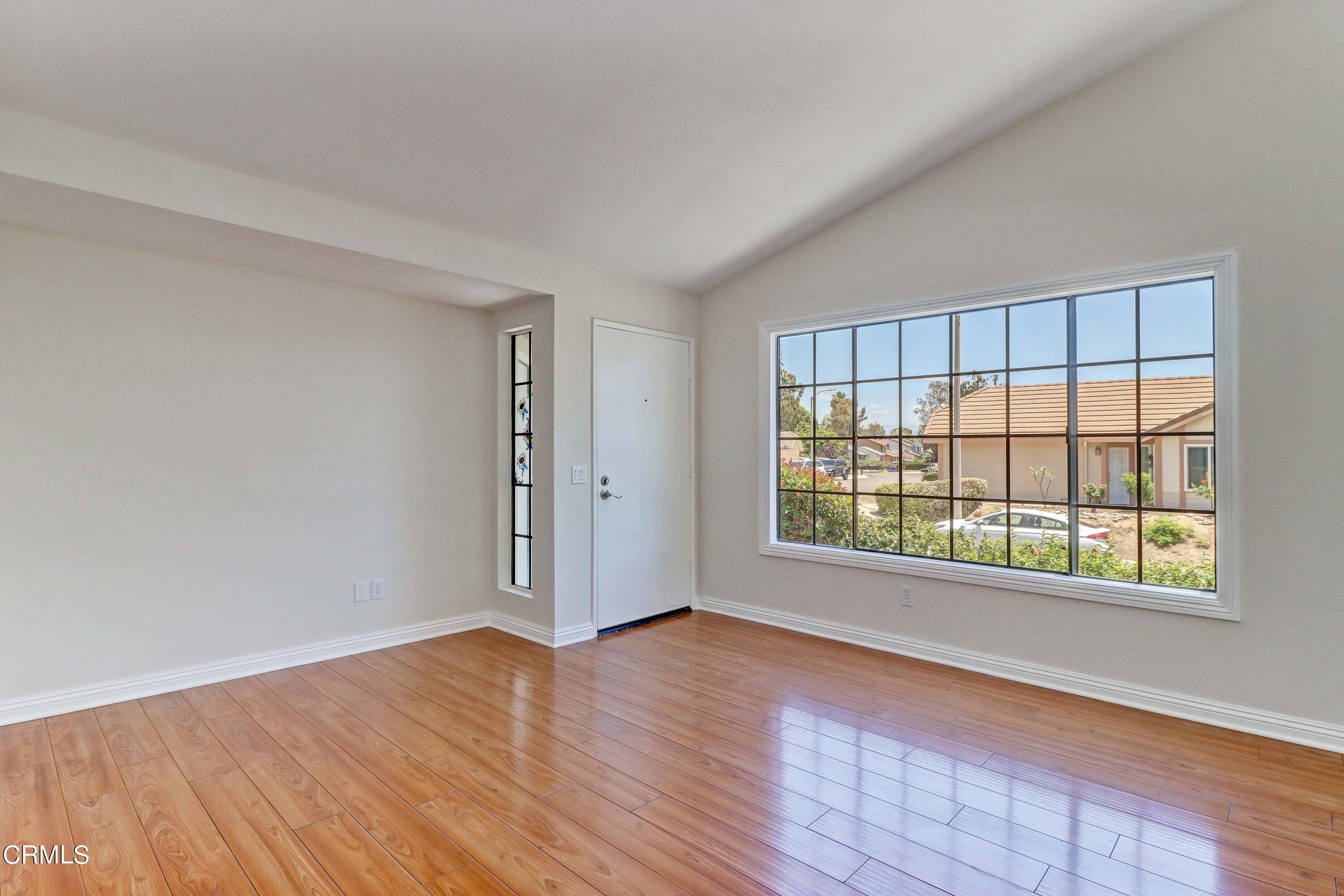 12399 Blazing Star Court Rancho Cucamonga, CA 91739 - Photo 5 of 24 an empty room with wooden floor and windows