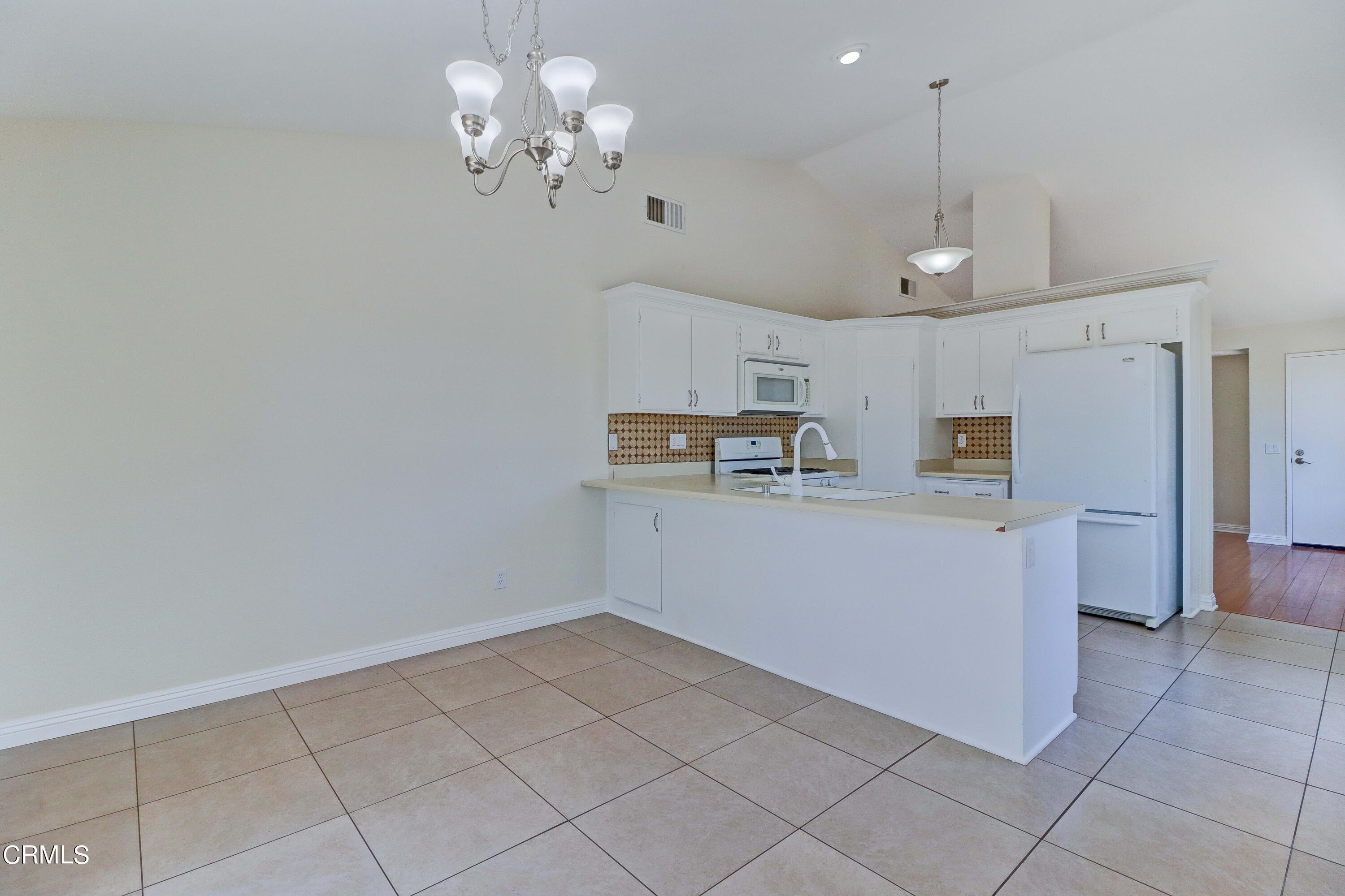 12399 Blazing Star Court Rancho Cucamonga, CA 91739 - Photo 9 of 24 a view of kitchen with window and refrigerator