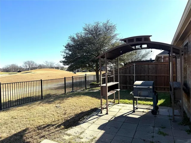 a view of a backyard with a garden
