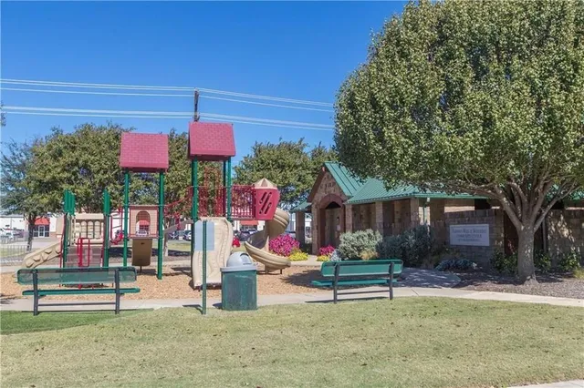 an outdoor sitting area with furniture